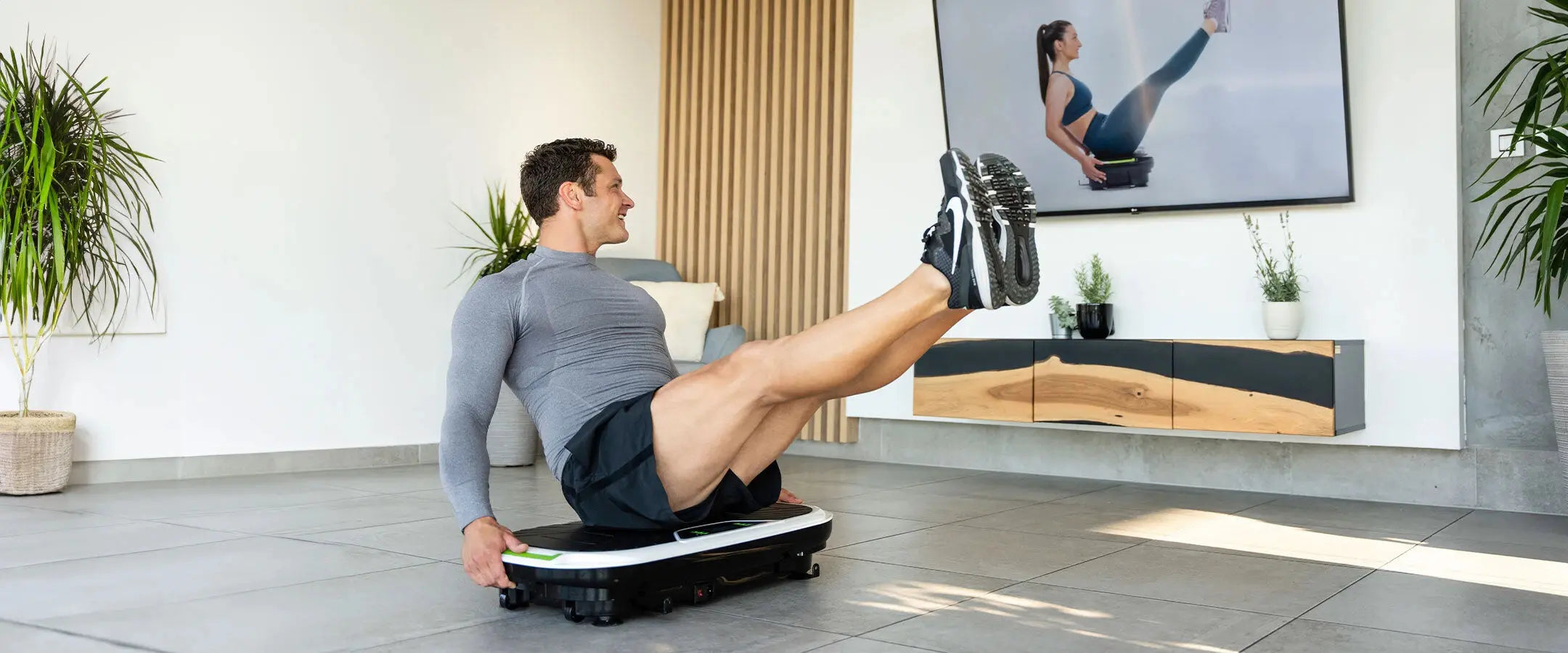 Woman exercising on Donnerberg vibration machine outdoors